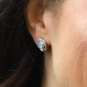 White gold and diamond Galanterie de Cartier stud earrings as seen on Meghan Markle