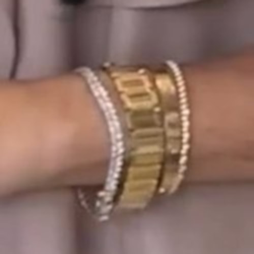 Meghan Markle wears Bentley & Skinner A Diamond Line Bracelet, Cartier Tank Francaise Gold Watch, â€‹and the Cartier â€˜Loveâ€™ Bangle and the Jennifer Meyer Gold Mini Bezel Tennis Bracelet.