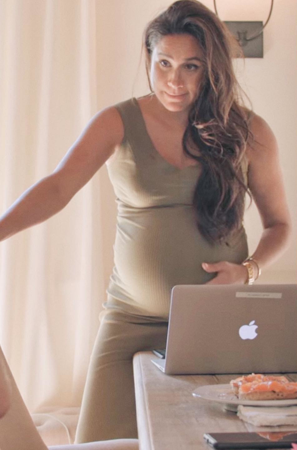 Meghan Markle wears Flounce London maternity ribbed midi tank dress in Khaki.