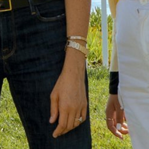 Meghan Markle wears Cartier 'Love' Yellow Gold Bracelet, and Princess Diana's gold Cartier tank française watch