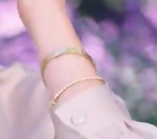 Cartier 'Love' Yellow Gold Bracelet and a thin gold ball chain bracelet. 
