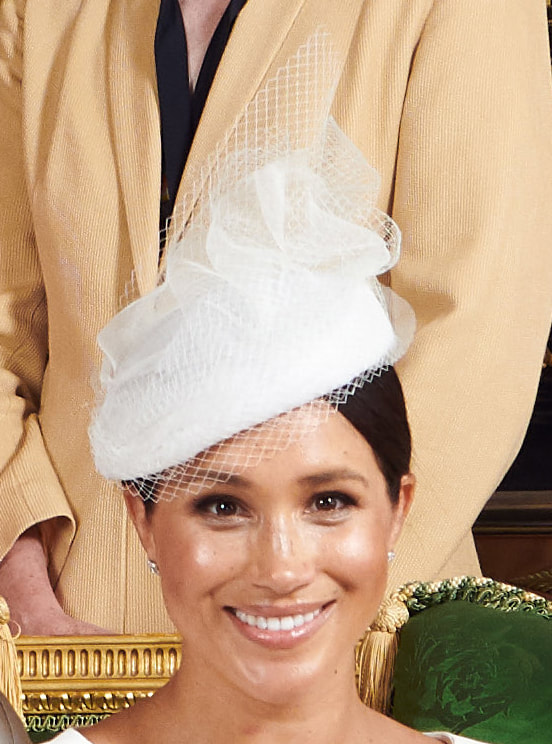 Duchess Meghan Markle wears white ribbon and net hat for Archie's christening