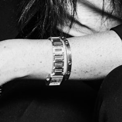 Meghan wore her Cartier ‘Love’ bangle bracelet, as well as Princess Diana’s Cartier Francaise Tank watch in gold. 