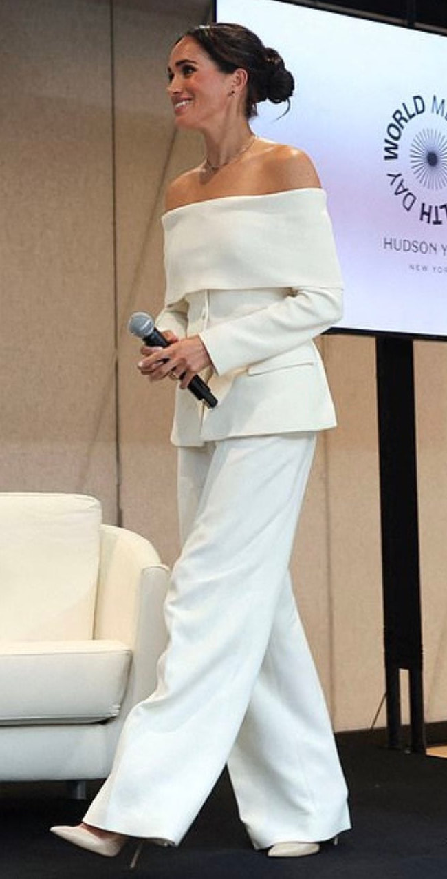 Meghan Markle wears Altuzarra off-the-shoulder virgin wool pant suit in ivory
